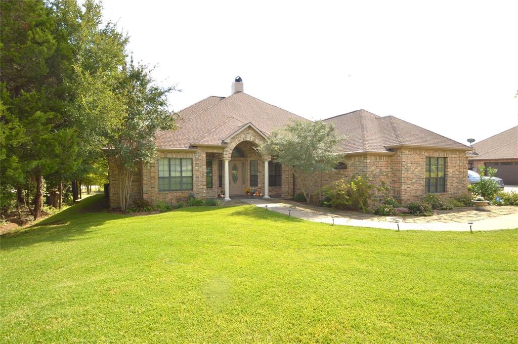 a view of a house with a yard and garage