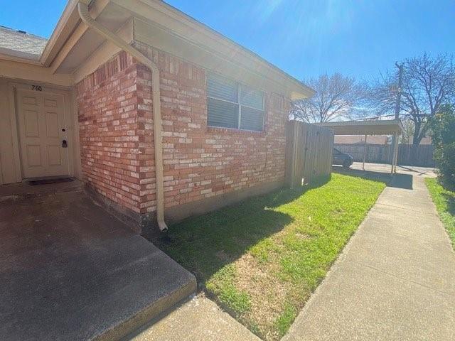 760 East Pecan Street Hurst, TX 76053 - Photo 1 of 1 a view of a backyard with brick wall