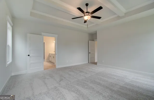 an empty room with fan