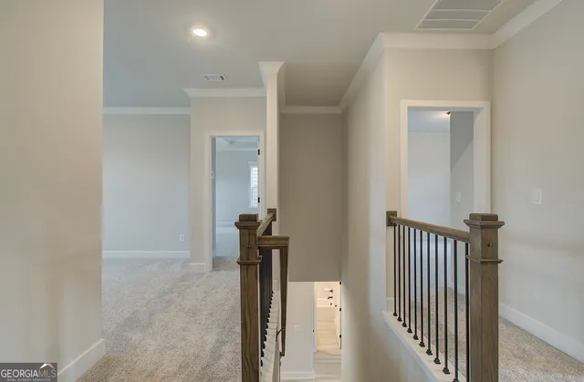 a view of a hallway with a room