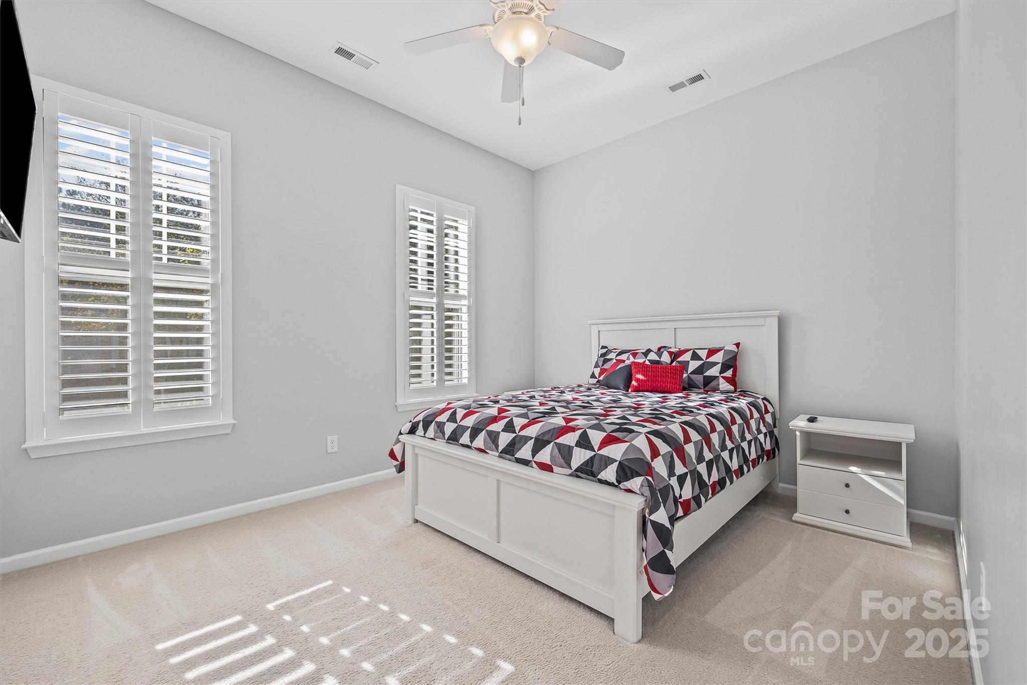 2090 Calloway Pines Drive Tega Cay, SC 29708 - Photo 14 of 38 a large bed sitting in a bedroom next to a window