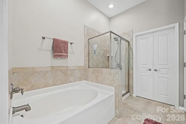 a bathroom with a bathtub and a shower