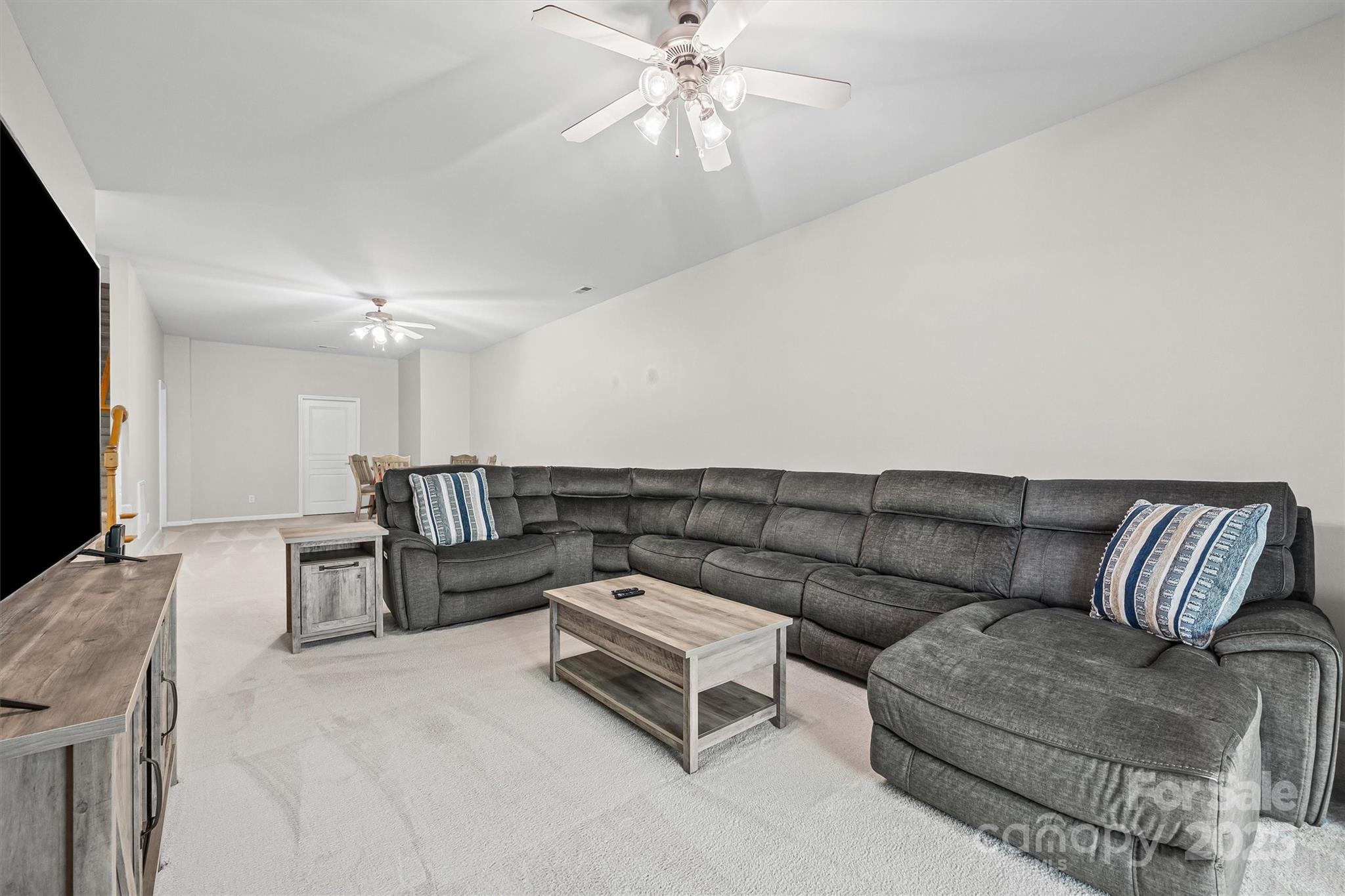 2090 Calloway Pines Drive Tega Cay, SC 29708 - Photo 19 of 38 a living room with furniture and a flat screen tv