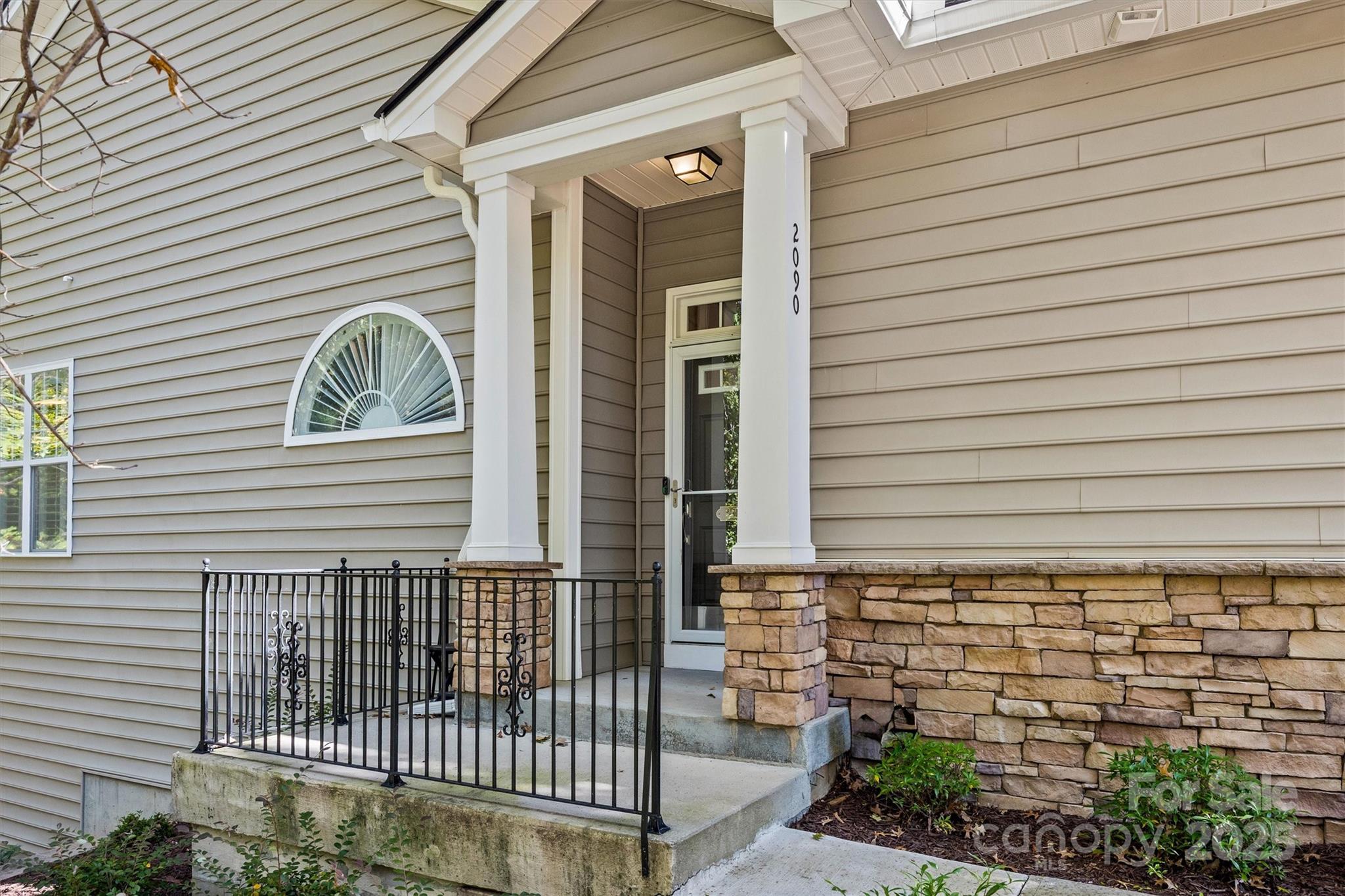 2090 Calloway Pines Drive Tega Cay, SC 29708 - Photo 2 of 38 a view of a house with a porch