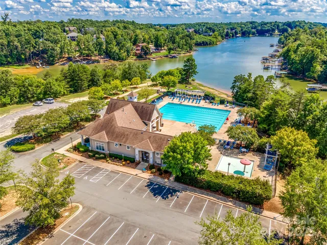 an aerial view of a house with a lake view