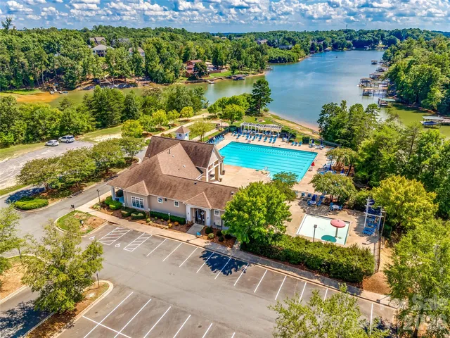 an aerial view of a house with a lake view