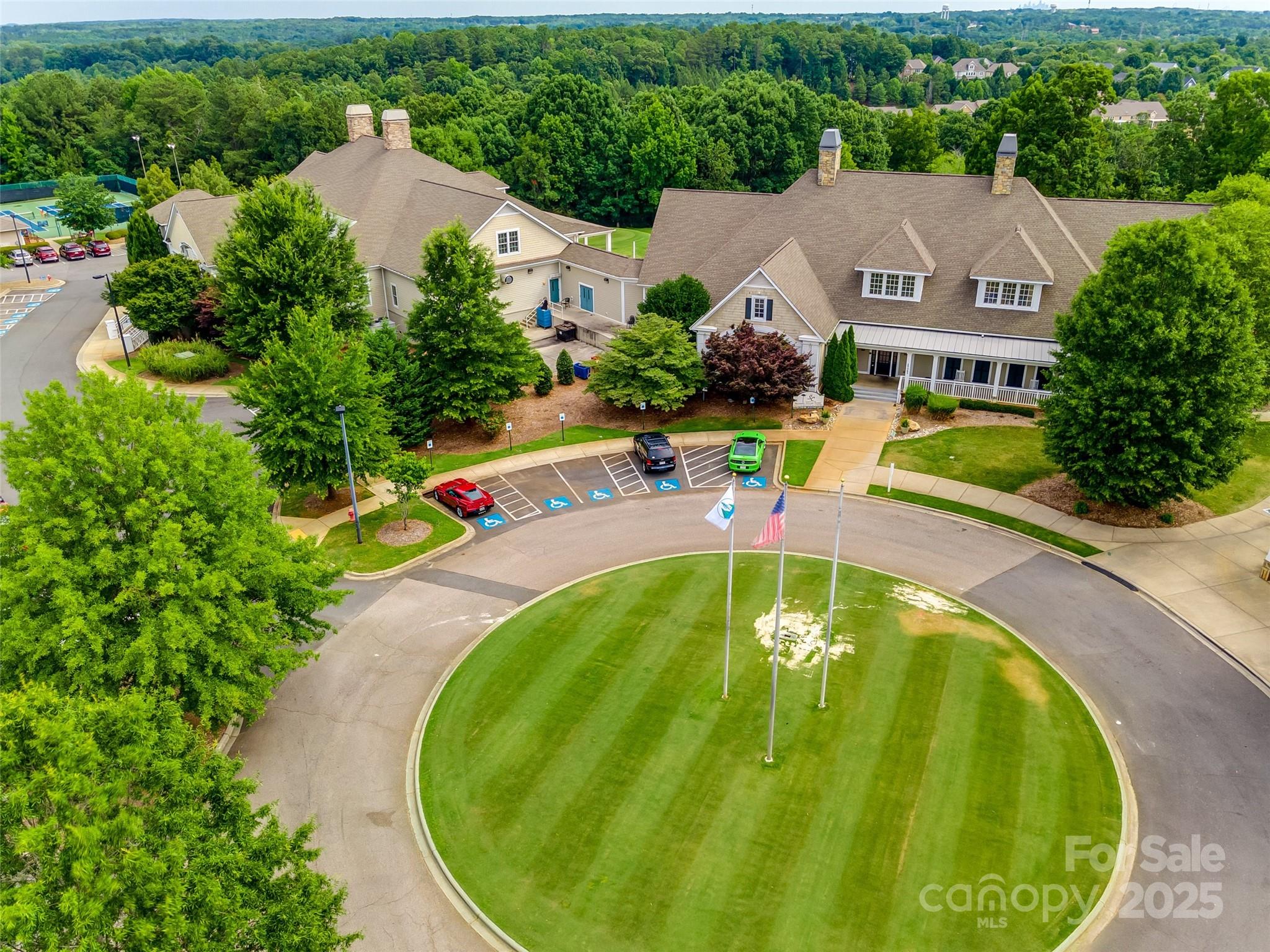 2090 Calloway Pines Drive Tega Cay, SC 29708 - Photo 30 of 38 an aerial view of residential houses with outdoor space and swimming pool