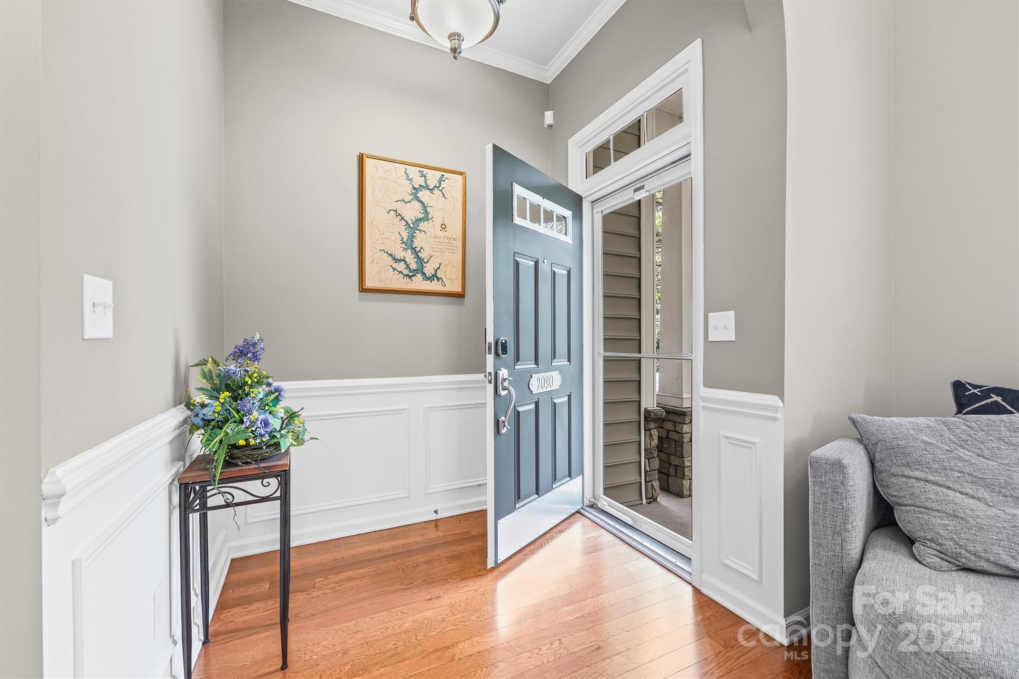 2090 Calloway Pines Drive Tega Cay, SC 29708 - Photo 3 of 38 a living room with furniture and a potted plant