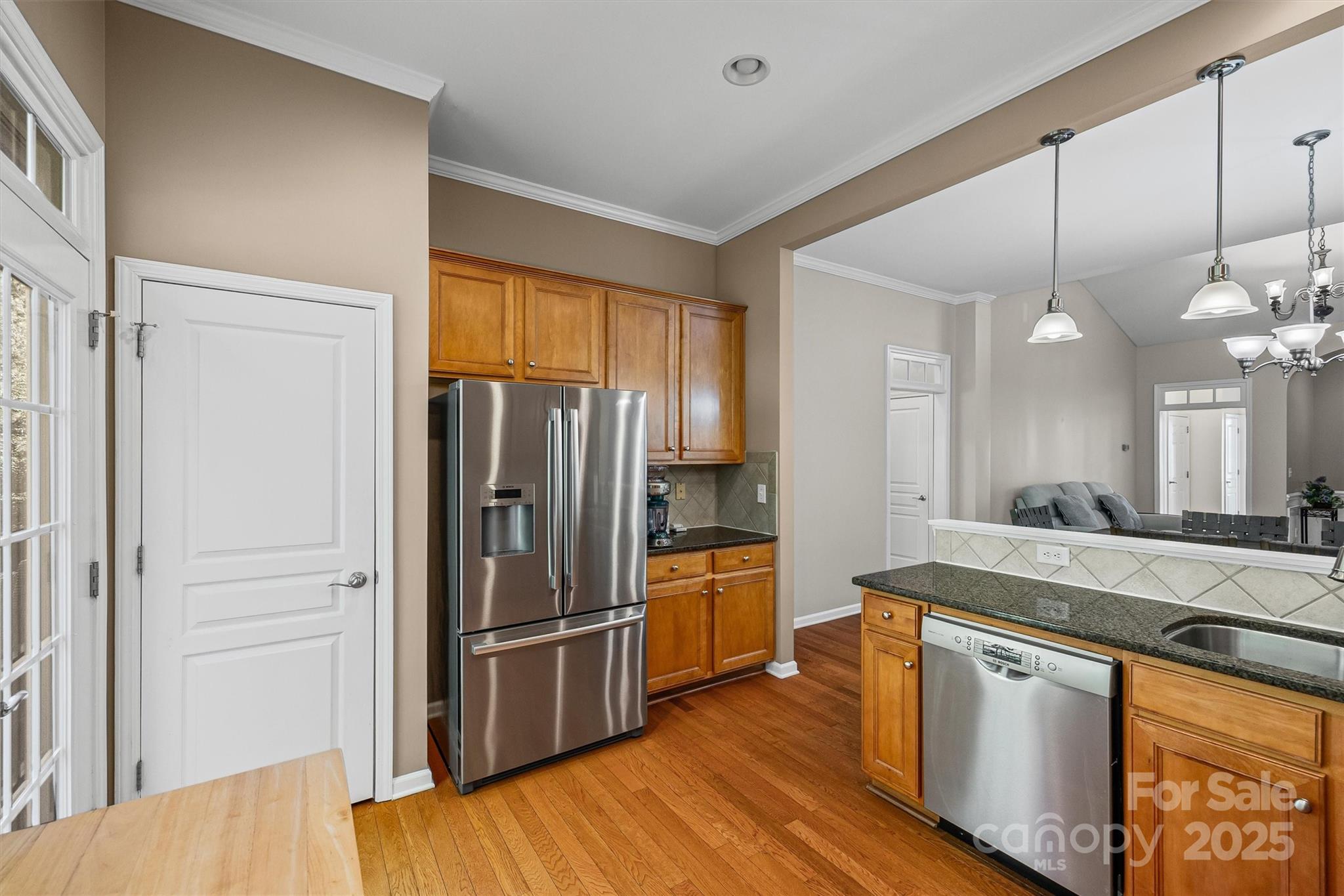 2090 Calloway Pines Drive Tega Cay, SC 29708 - Photo 9 of 38 a kitchen with stainless steel appliances granite countertop a refrigerator a sink and a stove