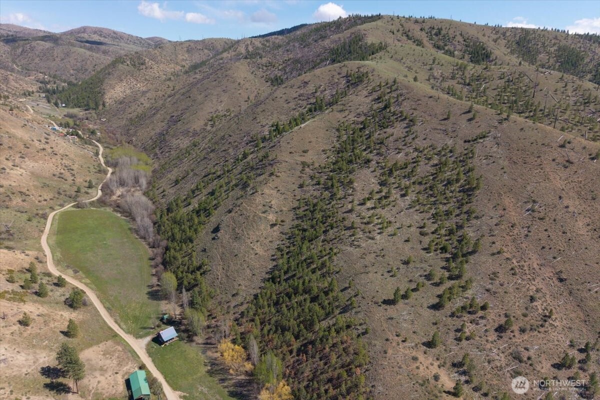 0 Bisping Canyon Road Entiat, WA 98822 - Photo 5 of 23 a view of a wooden wall with a mountain in the background