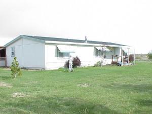 5003 Beam Road Granger, WA 98932 - Photo 1 of 14 a backyard of a house with table and chairs