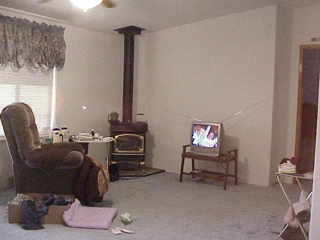 5003 Beam Road Granger, WA 98932 - Photo 14 of 14 a living room with furniture and a fireplace