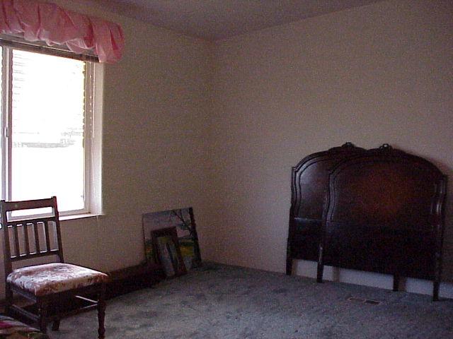 5003 Beam Road Granger, WA 98932 - Photo 3 of 14 a bedroom with a bed and a mirror