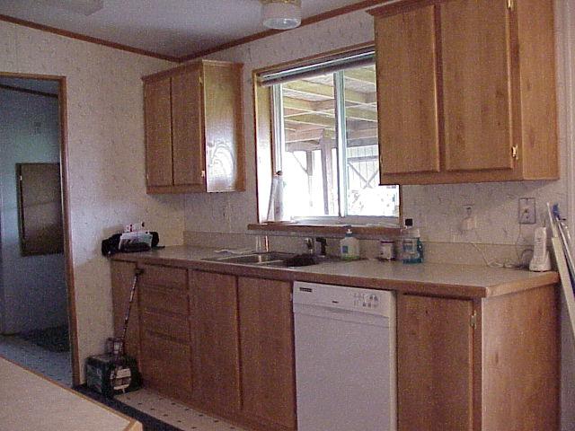 5003 Beam Road Granger, WA 98932 - Photo 7 of 14 a kitchen with stainless steel appliances granite countertop a sink stove and cabinets