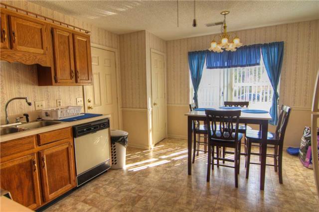 3441 Country Way Road Antioch, TN 37013 - Photo 4 of 9 a kitchen with granite countertop a table chairs stove and microwave