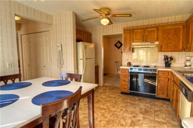 3441 Country Way Road Antioch, TN 37013 - Photo 5 of 9 a kitchen with stainless steel appliances granite countertop a sink a stove and a refrigerator