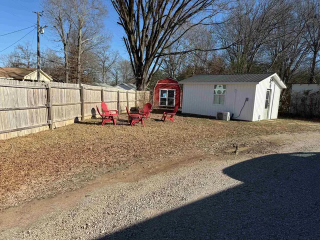 a view of a house with a snow in a yard