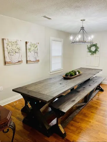 a room with pool table and window