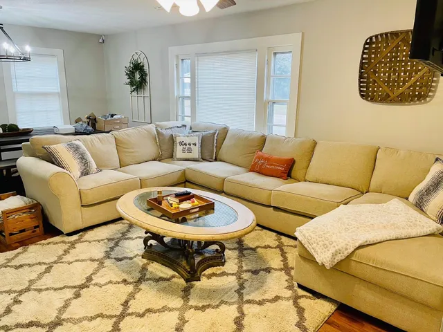 a living room with a couch and a couch