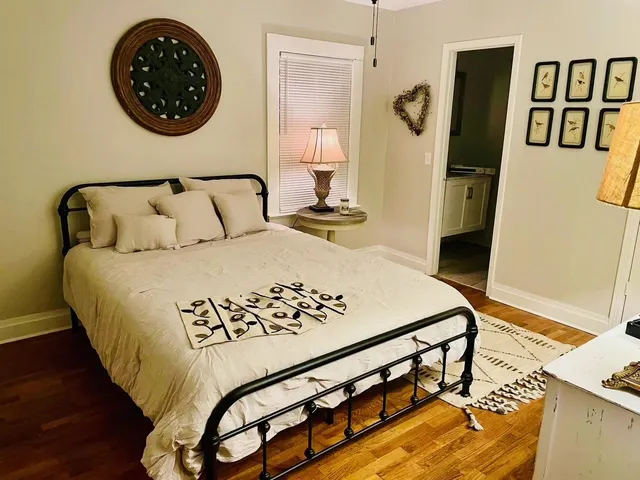 a bedroom with a bed and dresser