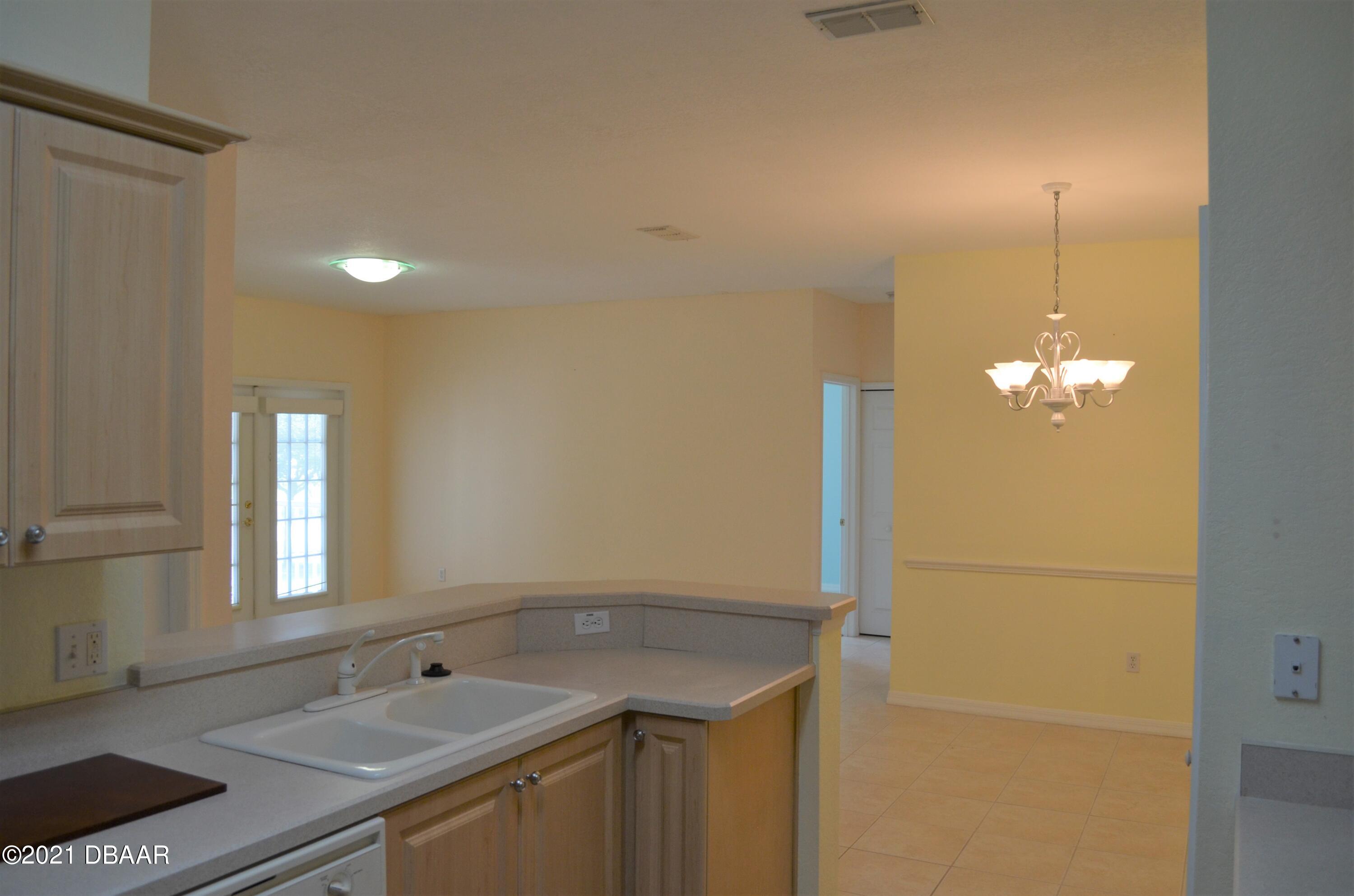 830 Airport Road, Unit 711 Port Orange, FL 32128 - Photo 20 of 47 a bathroom with a sink and a mirror