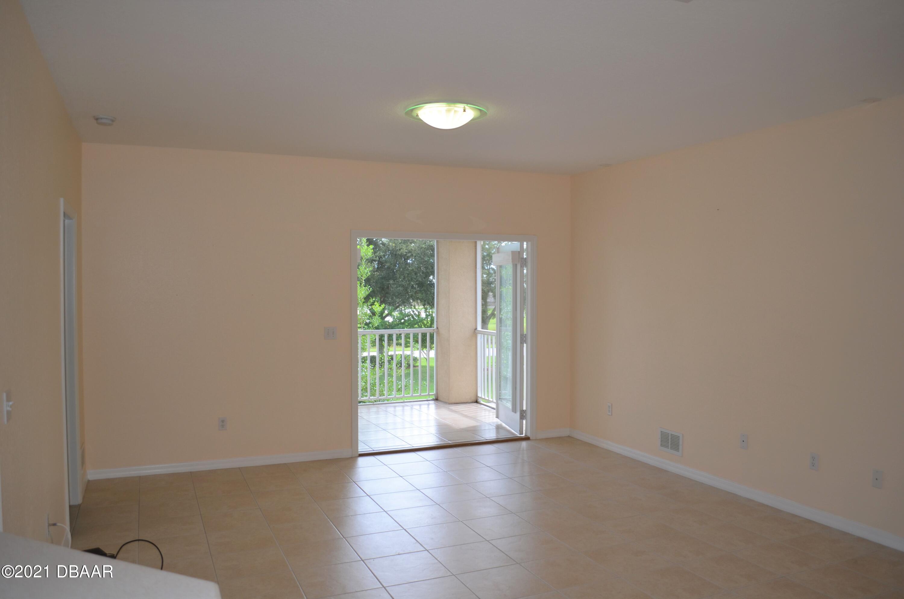830 Airport Road, Unit 711 Port Orange, FL 32128 - Photo 23 of 47 a view of an empty room with a window