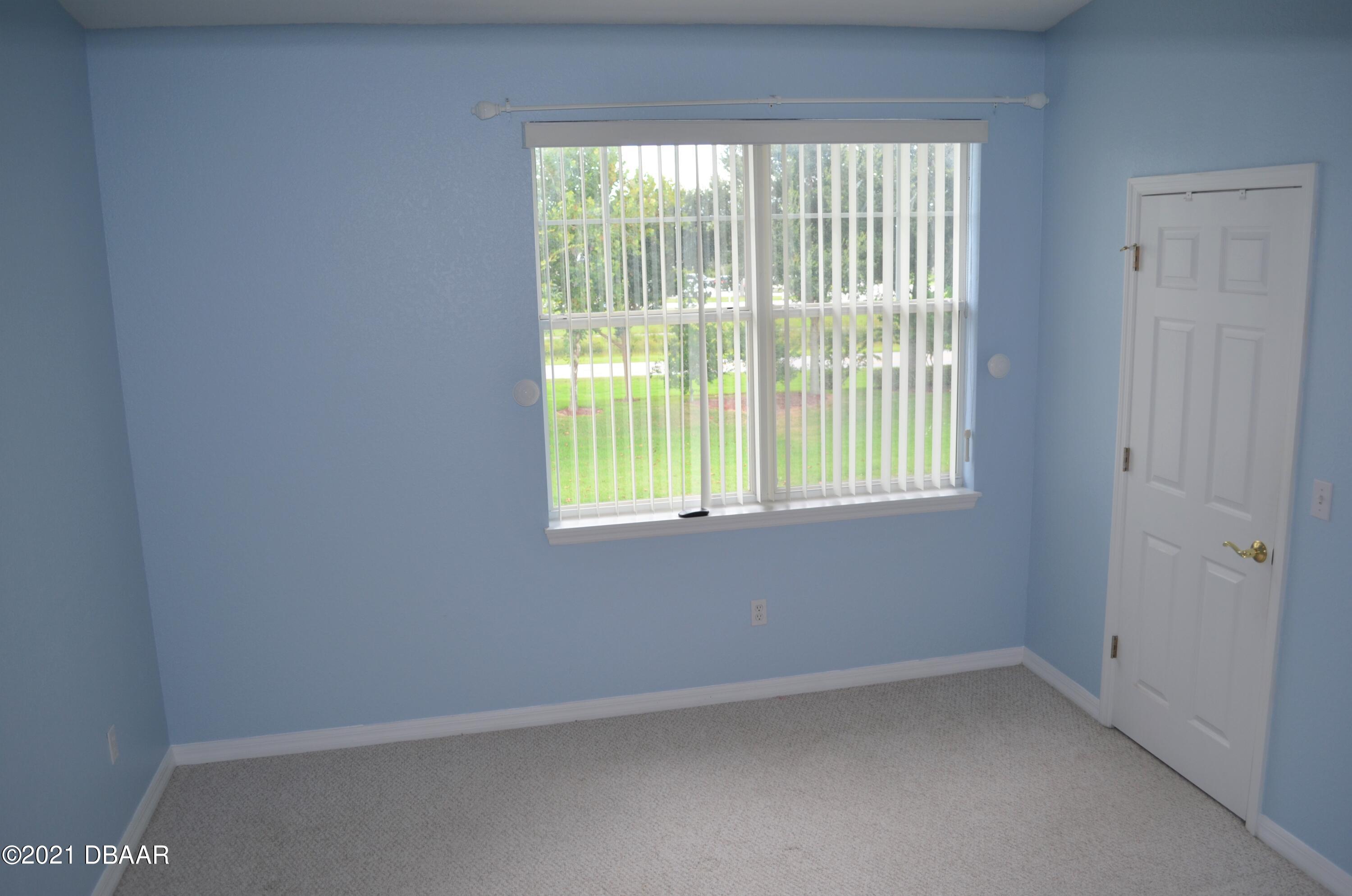830 Airport Road, Unit 711 Port Orange, FL 32128 - Photo 26 of 47 an empty room with a window