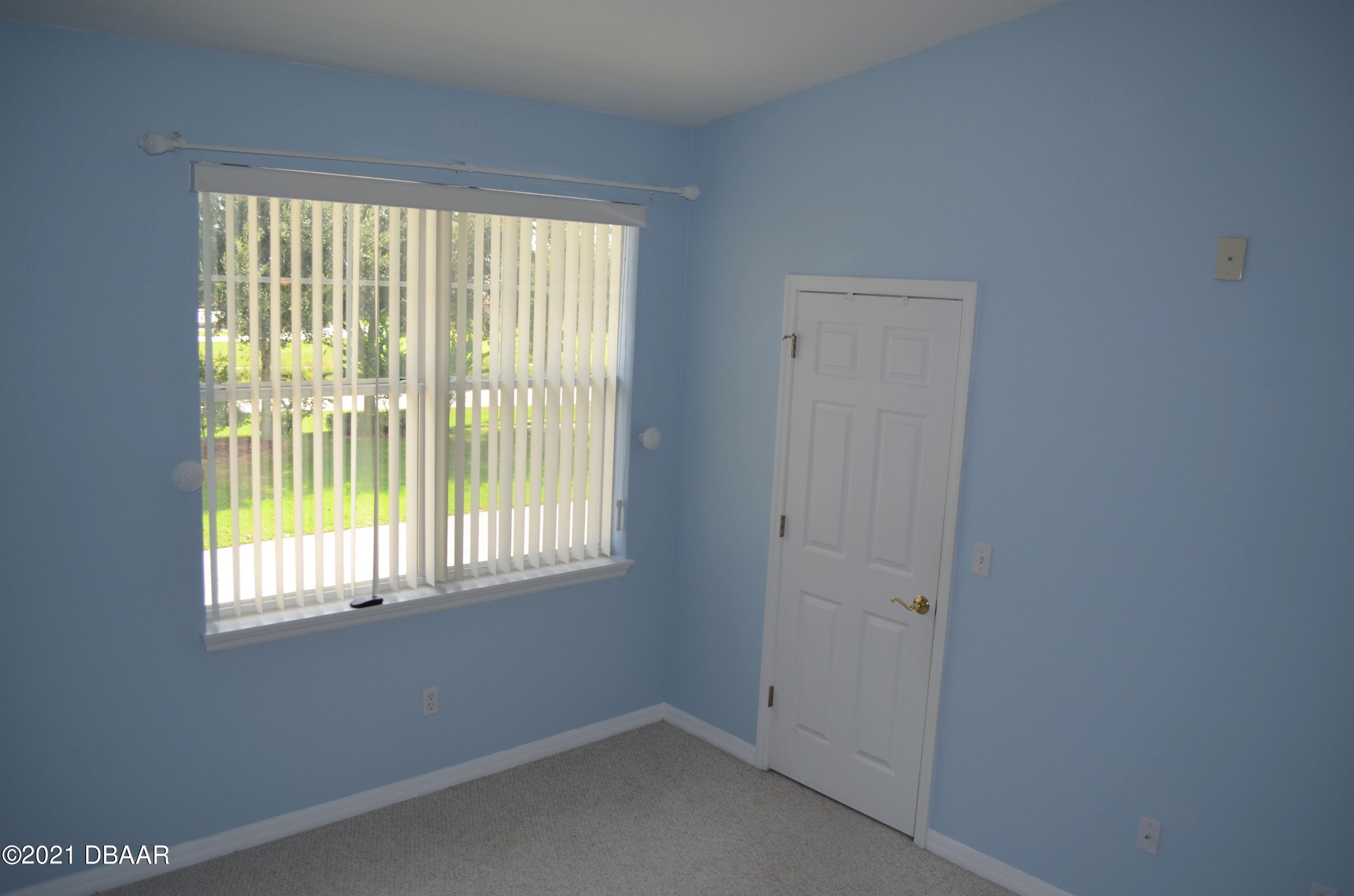 830 Airport Road, Unit 711 Port Orange, FL 32128 - Photo 27 of 47 a view of an empty room with a window