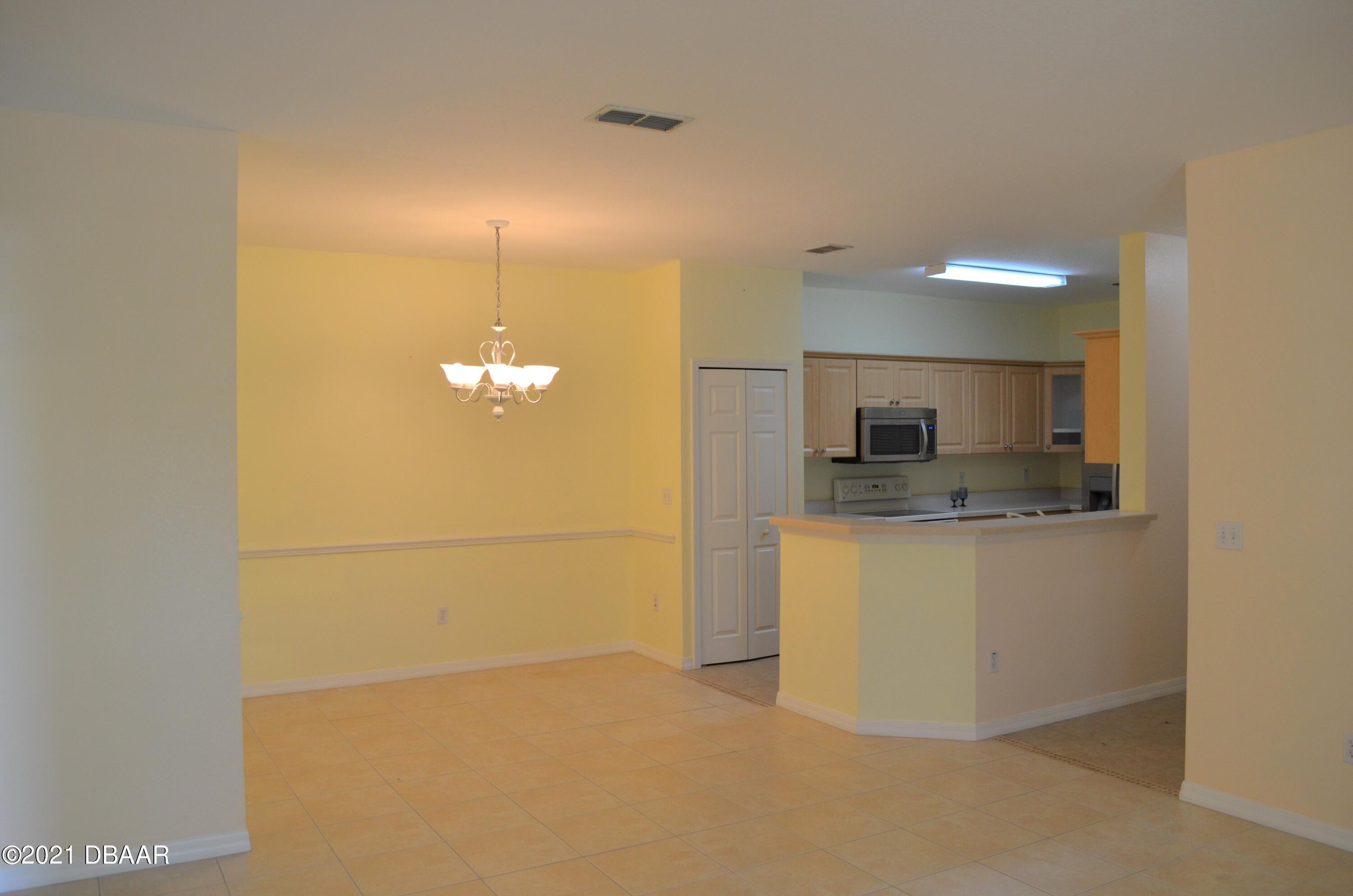 830 Airport Road, Unit 711 Port Orange, FL 32128 - Photo 3 of 47 a bathroom with a sink and a mirror