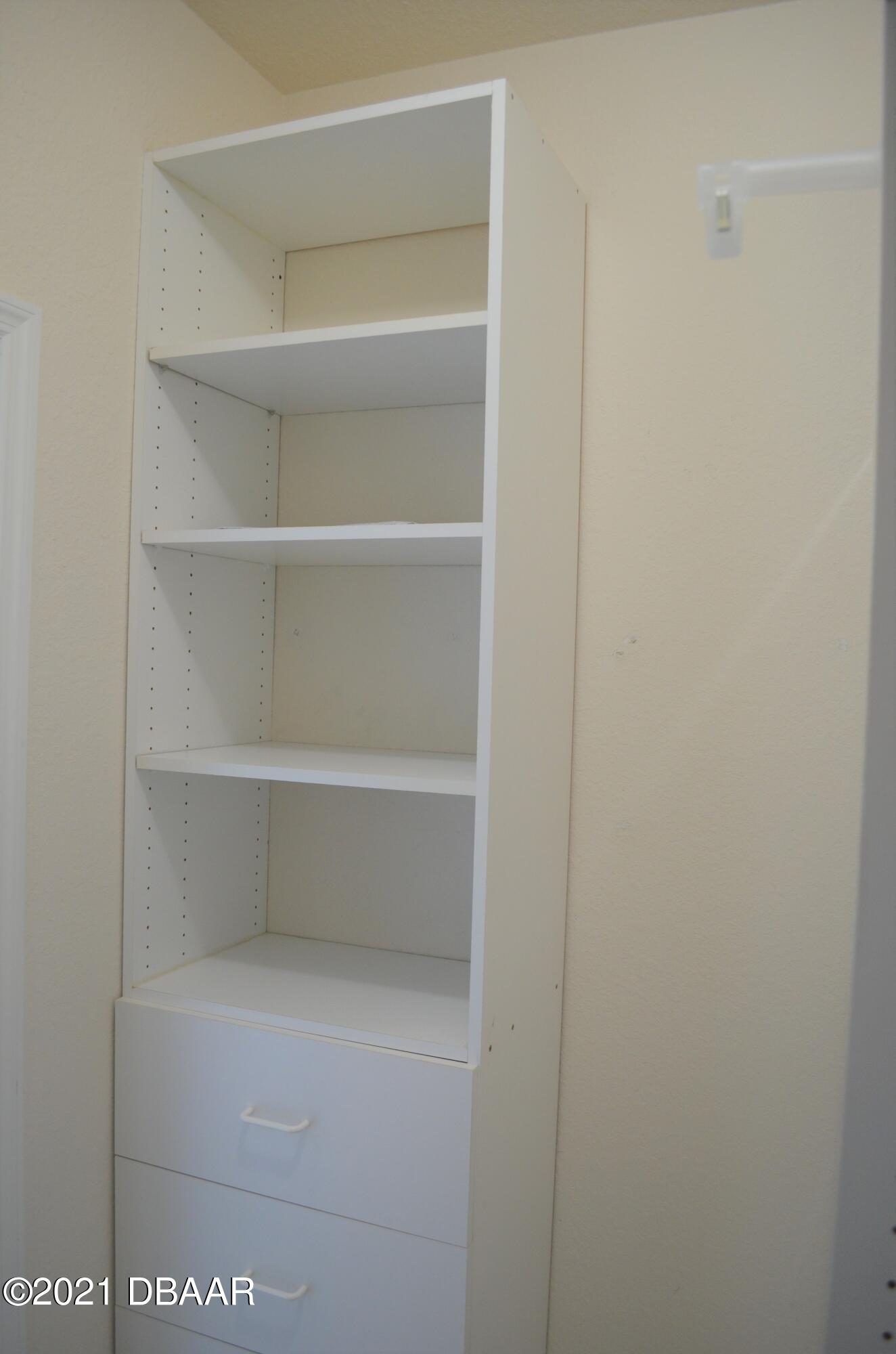 830 Airport Road, Unit 711 Port Orange, FL 32128 - Photo 32 of 47 a view of an empty walk in closet