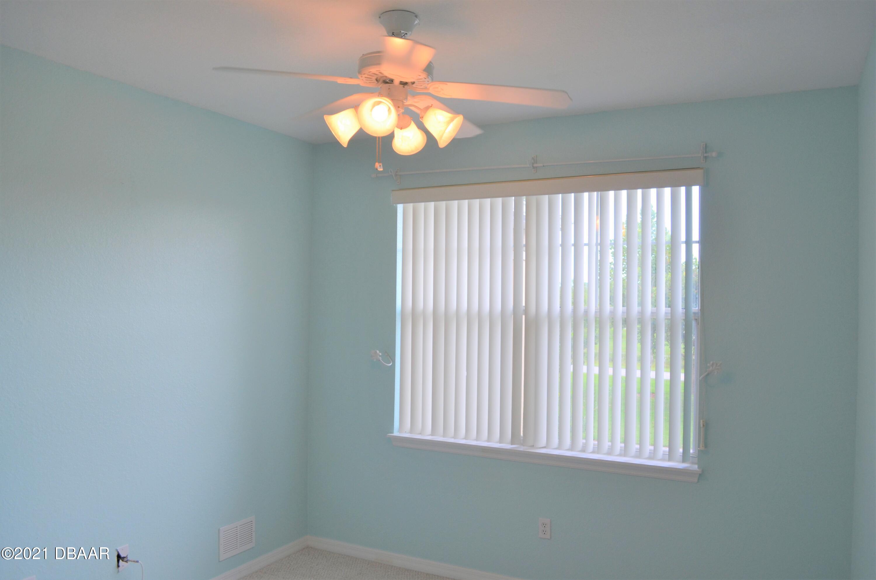 830 Airport Road, Unit 711 Port Orange, FL 32128 - Photo 37 of 47 en empty room with window