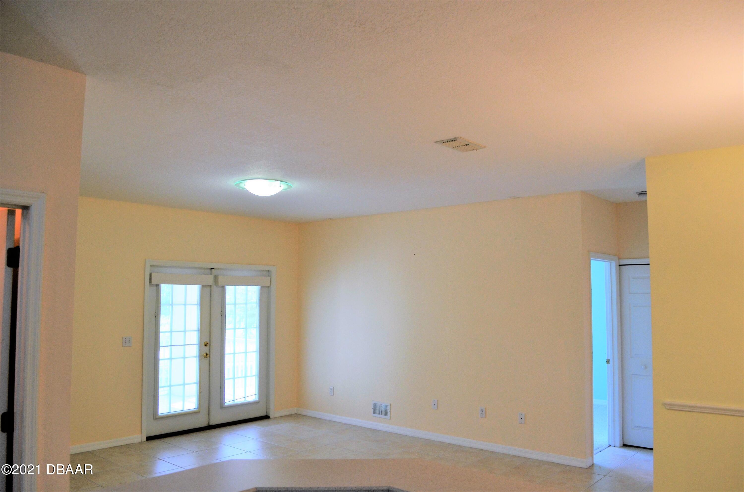 830 Airport Road, Unit 711 Port Orange, FL 32128 - Photo 4 of 47 a view of an empty room