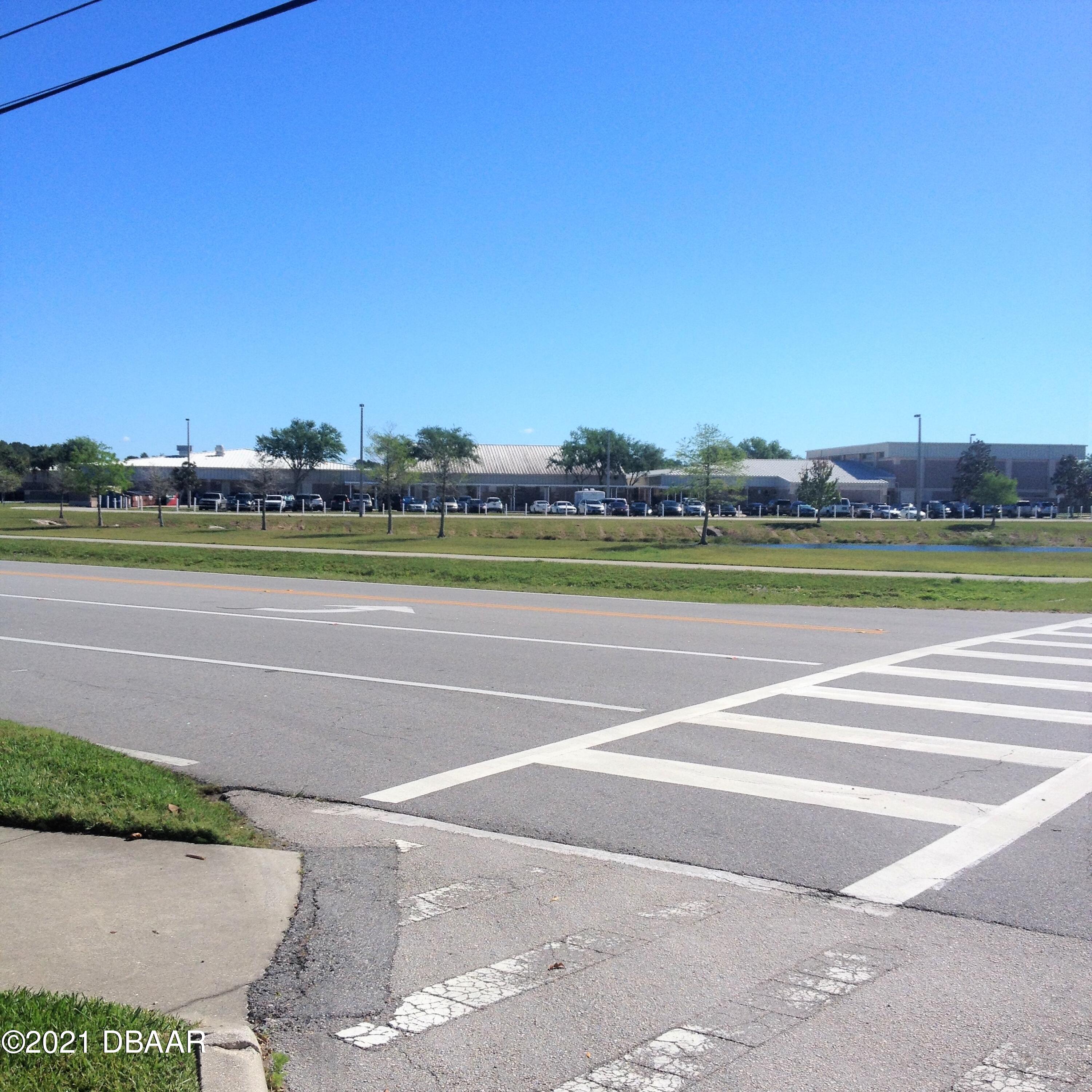 830 Airport Road, Unit 711 Port Orange, FL 32128 - Photo 46 of 47 a view of a tennis court