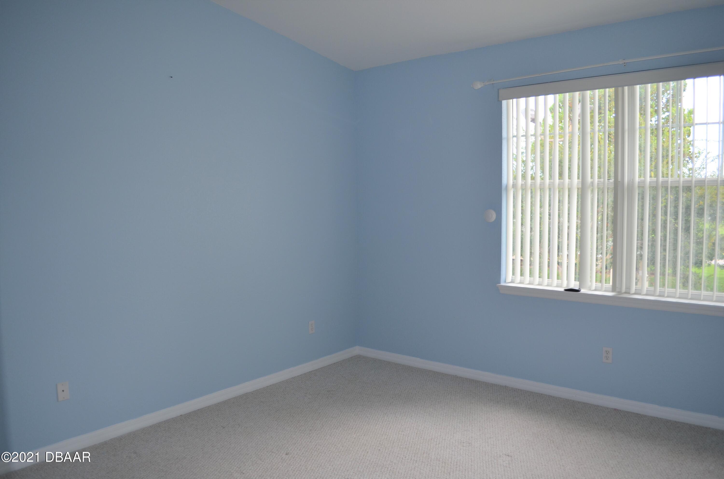 830 Airport Road, Unit 711 Port Orange, FL 32128 - Photo 5 of 47 an empty room with a window