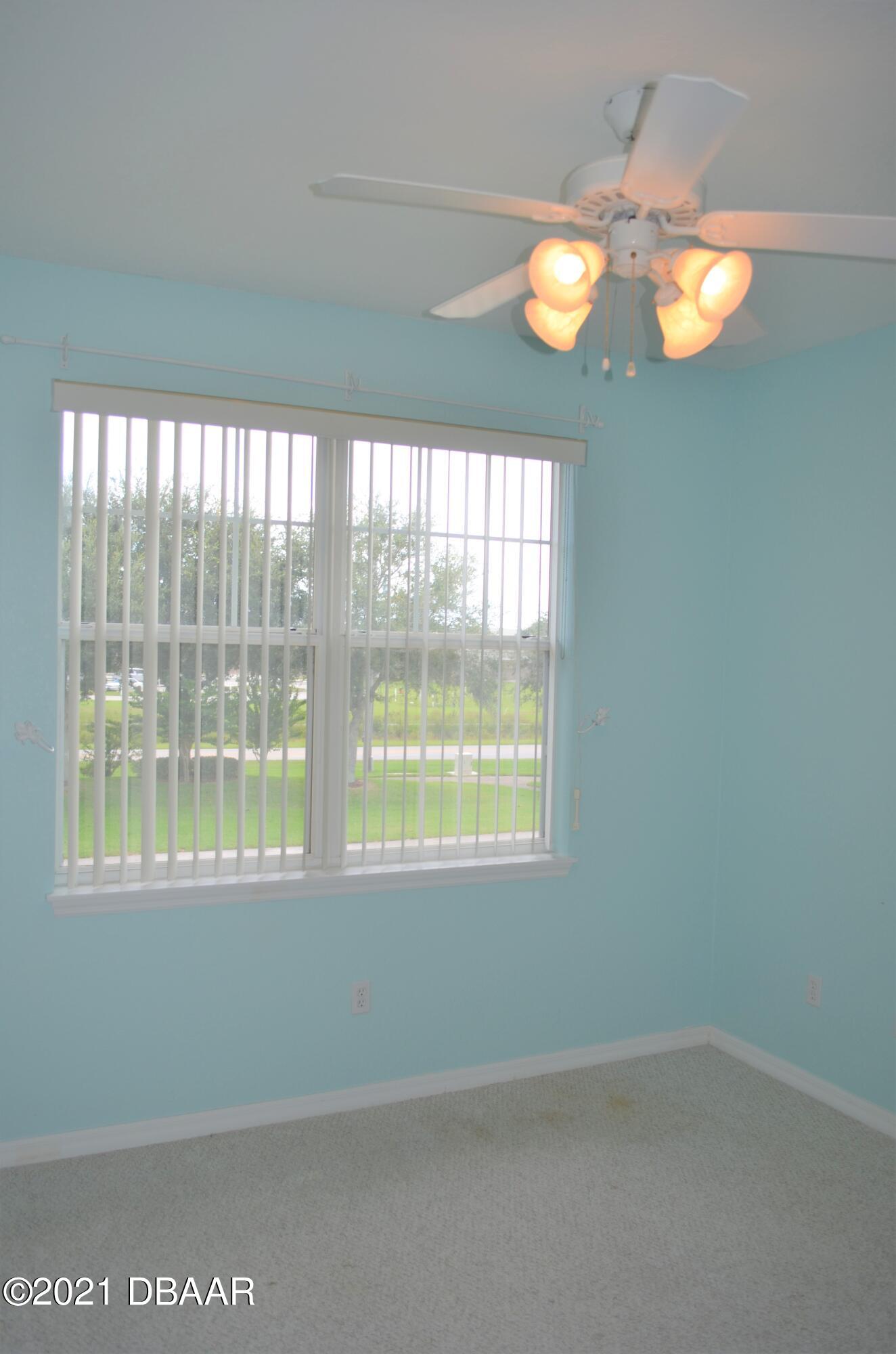 830 Airport Road, Unit 711 Port Orange, FL 32128 - Photo 8 of 47 a view of an empty room with a window