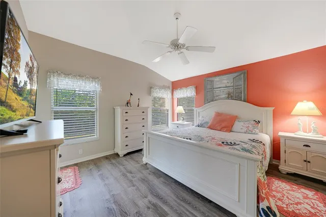 a room with a bed and a flat screen tv