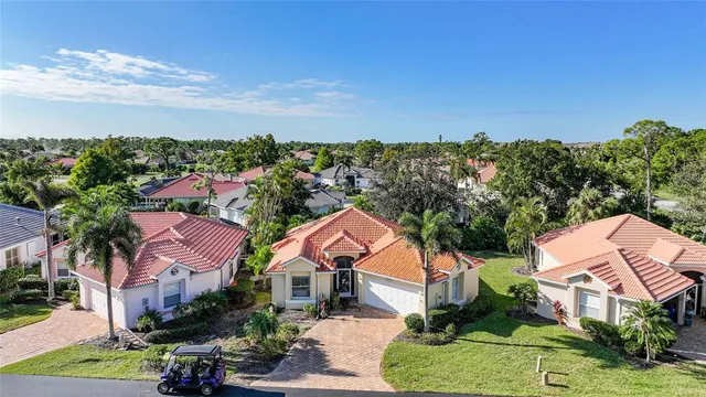 an aerial view of residential houses with outdoor space and street view