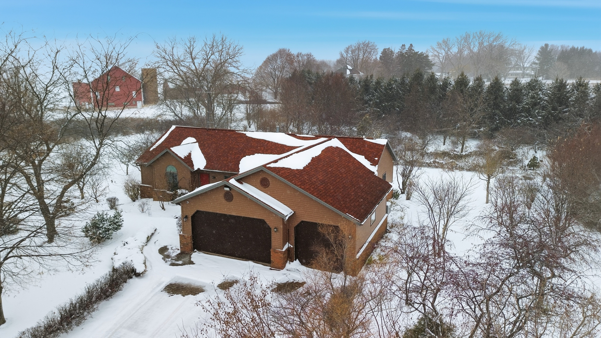 678 Pheasant Run Dixon, IL 61021 - Photo 4 of 29 a view of a house with a yard covered in snow
