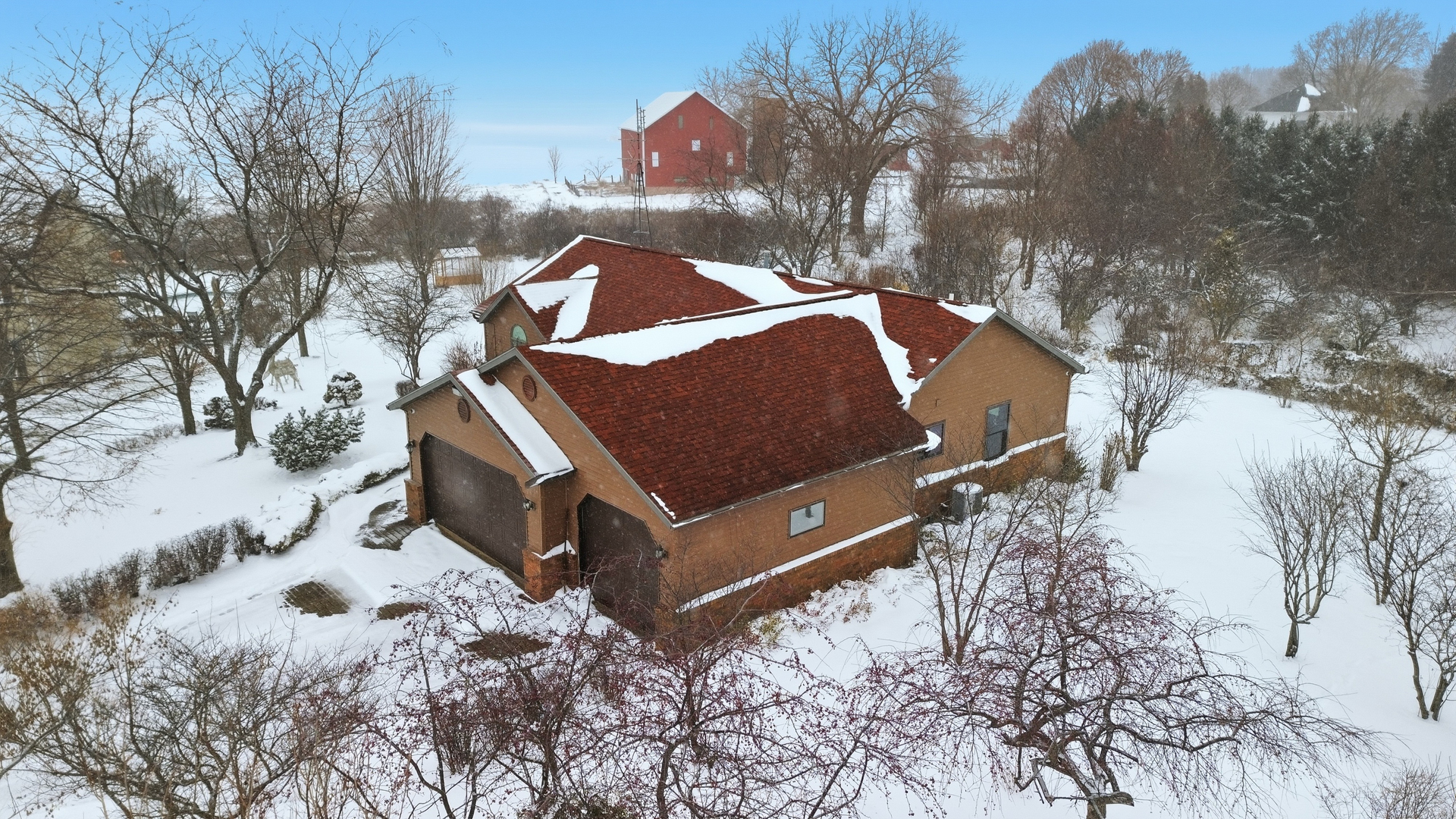 678 Pheasant Run Dixon, IL 61021 - Photo 5 of 29 a view of a house with a yard covered with snow in the background