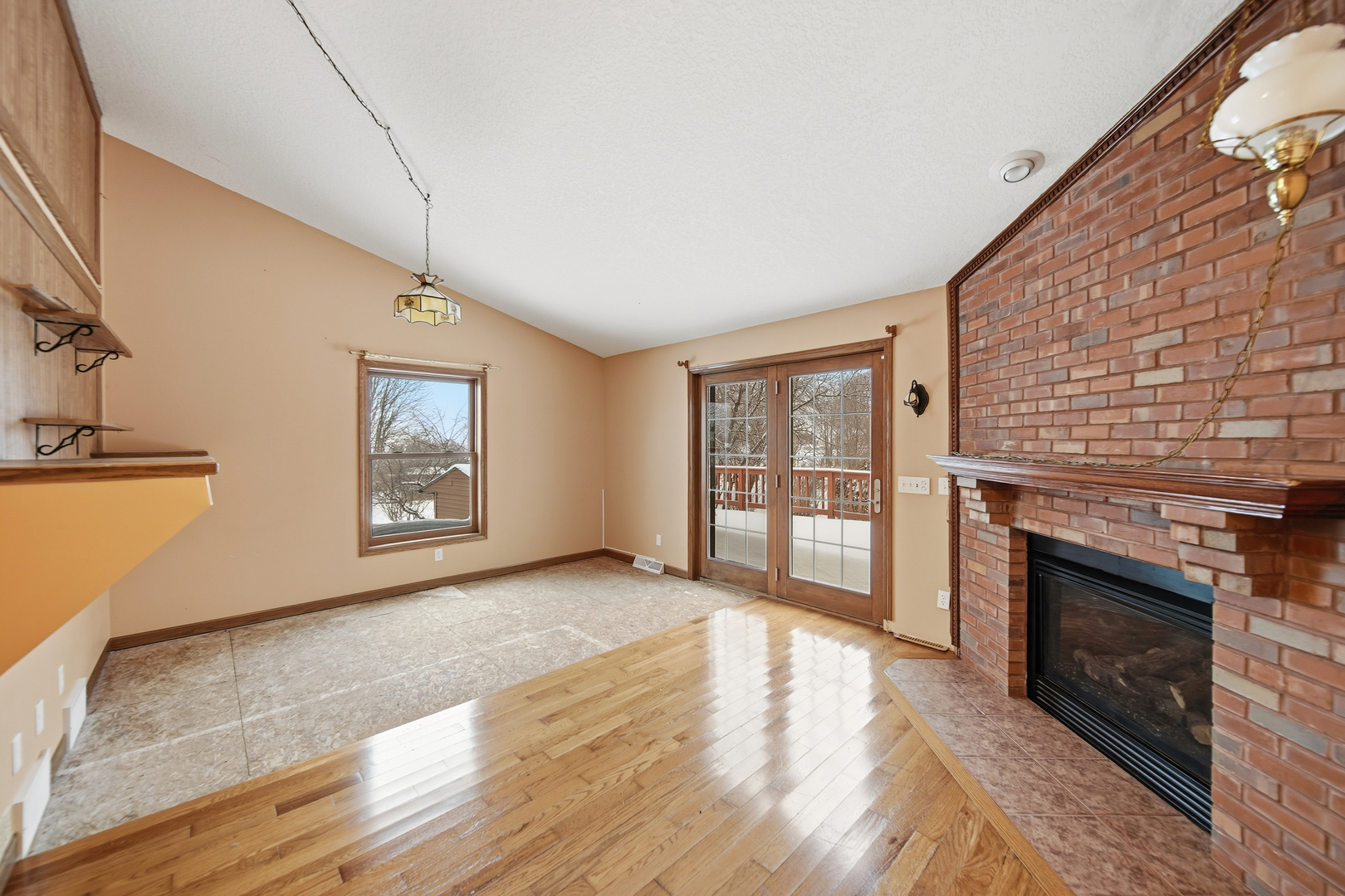 678 Pheasant Run Dixon, IL 61021 - Photo 6 of 29 a view of an empty room with a fireplace and a window