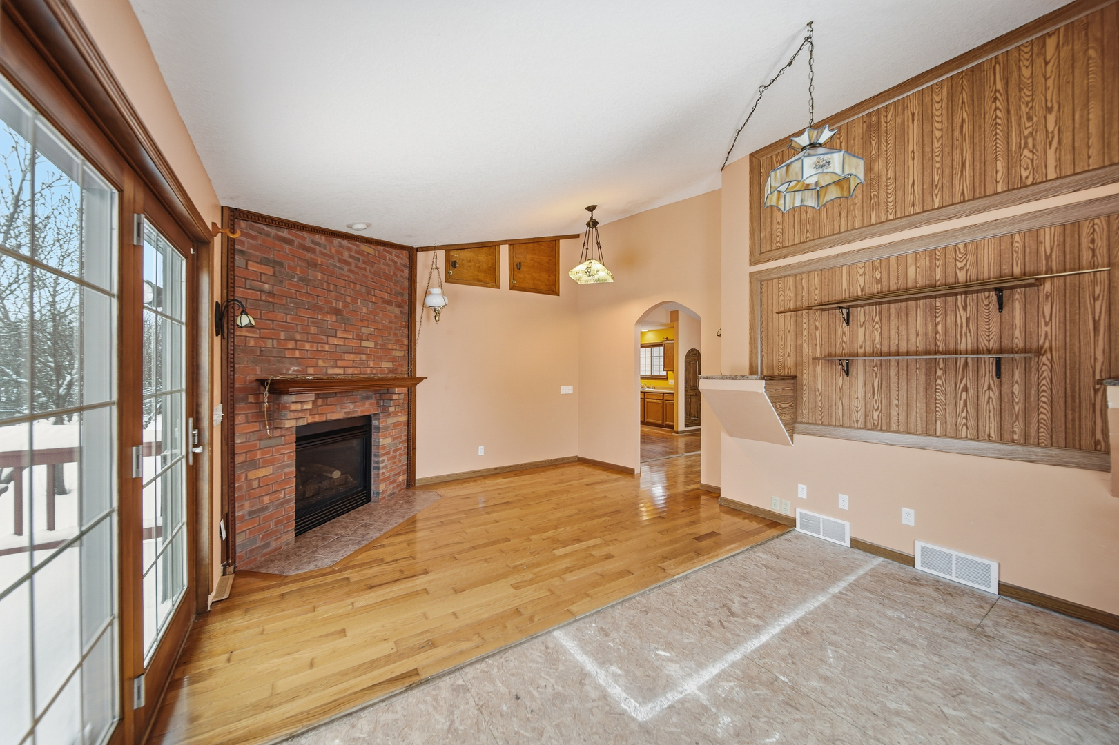 678 Pheasant Run Dixon, IL 61021 - Photo 8 of 29 a view of empty room with a fireplace and windows
