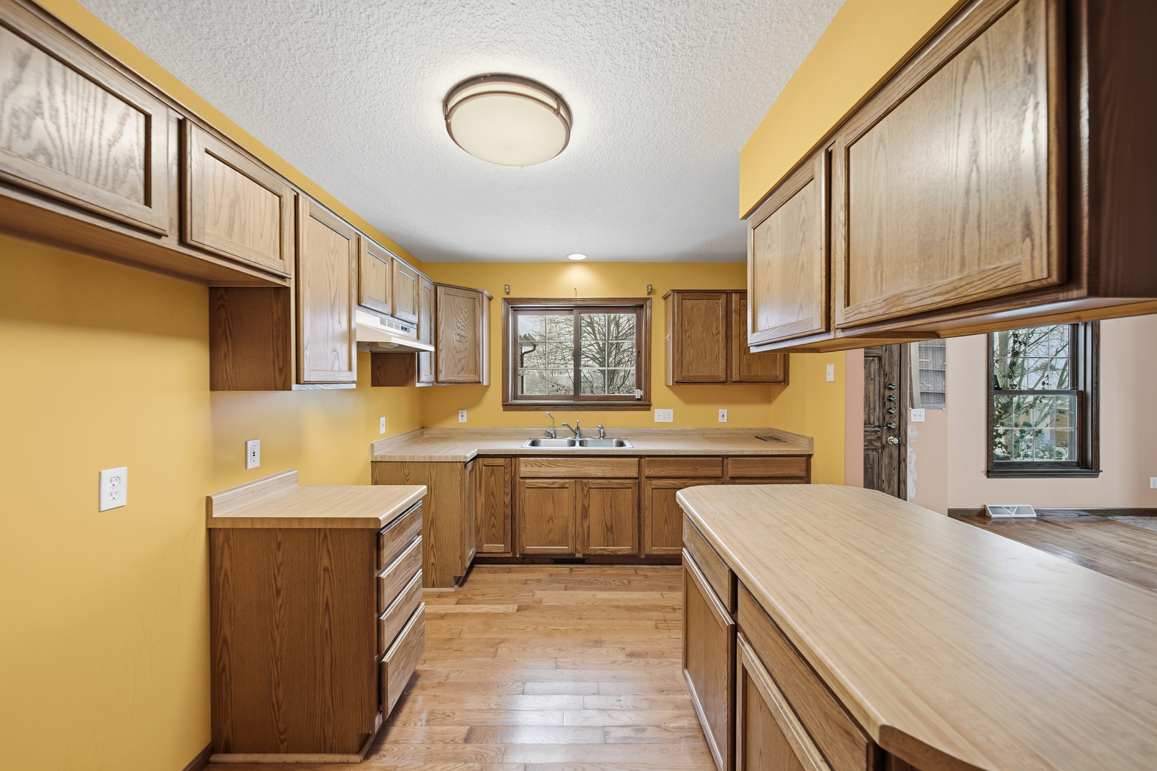 678 Pheasant Run Dixon, IL 61021 - Photo 9 of 29 a kitchen with cabinets and window