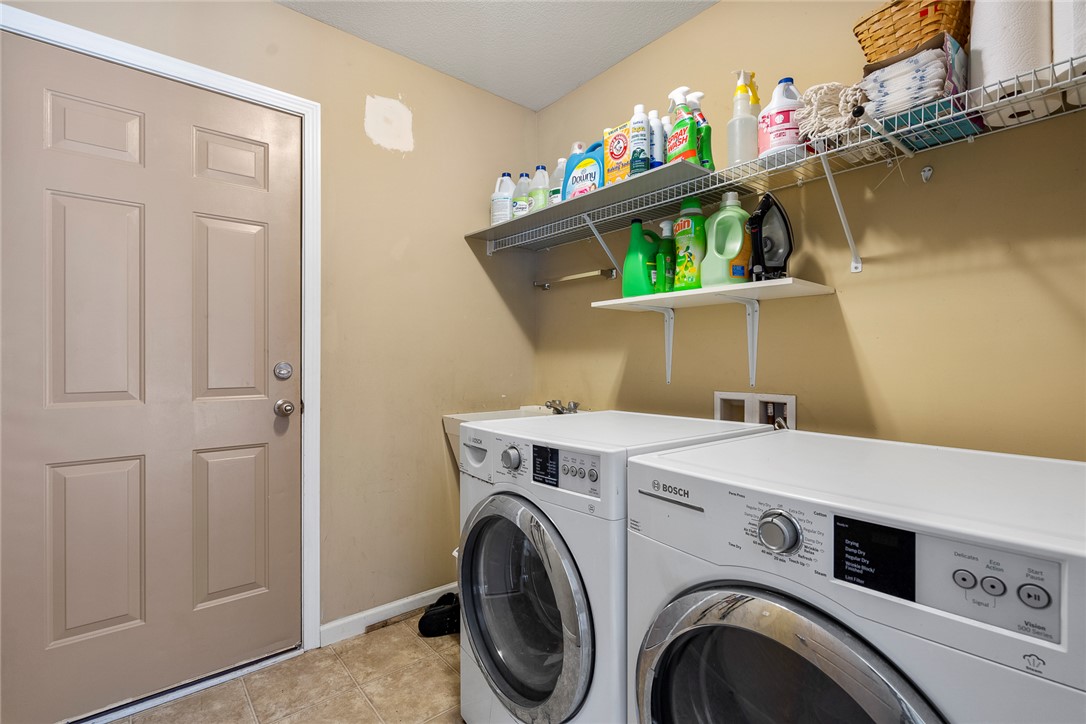 167 Mediterranean Avenue Anderson, SC 29621 - Photo 26 of 33 Functional laundry room equipped with convenient wall shelving.