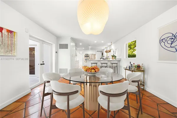 a spacious bedroom with a bed and a window