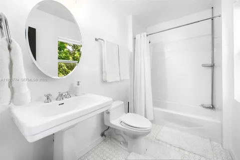 a balcony with furniture and flowers