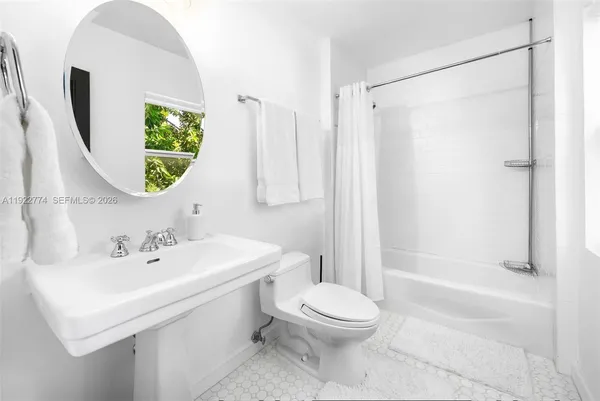 a balcony with furniture and flowers