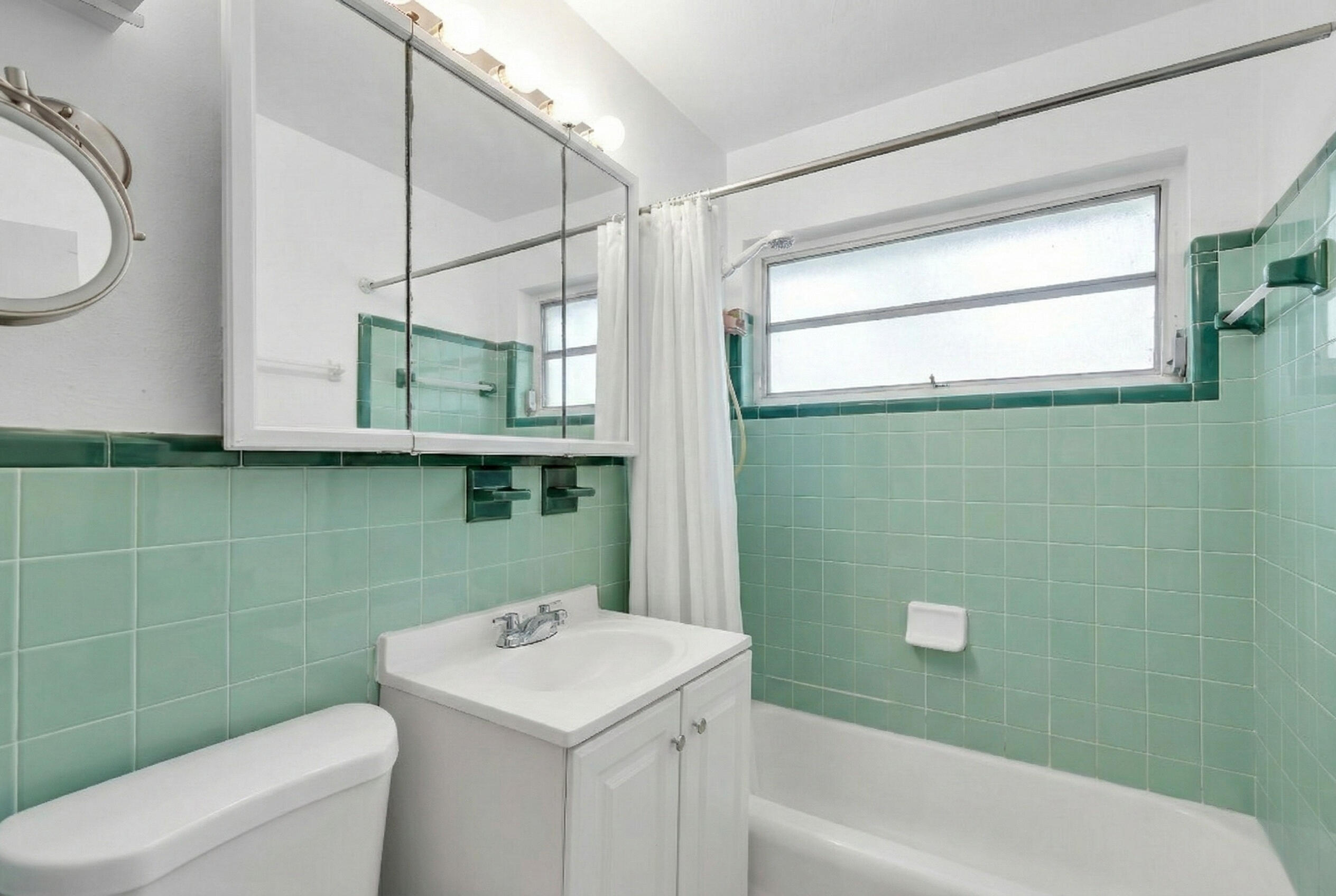 1614 Dennis Street Key West, FL 33040 - Photo 17 of 59 a bathroom with a sink a toilet and shower