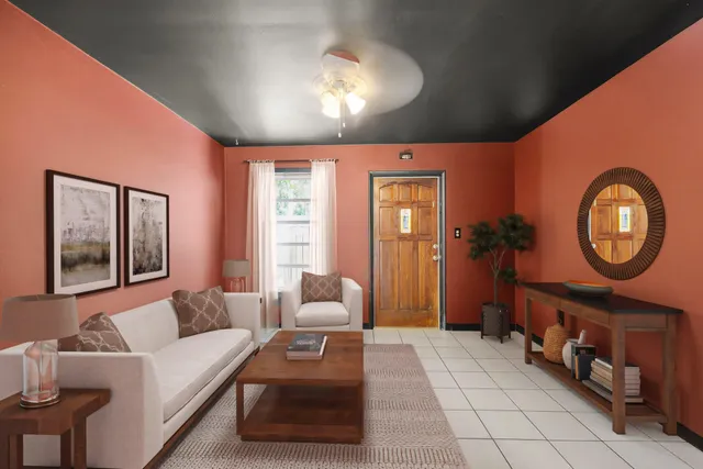 a kitchen with a sink a refrigerator and cabinets