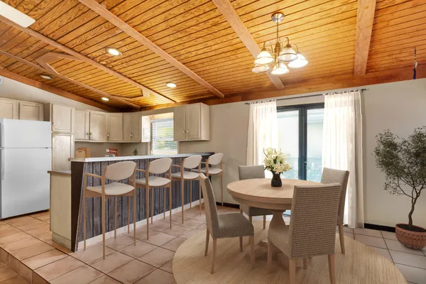 a dining room with furniture and window