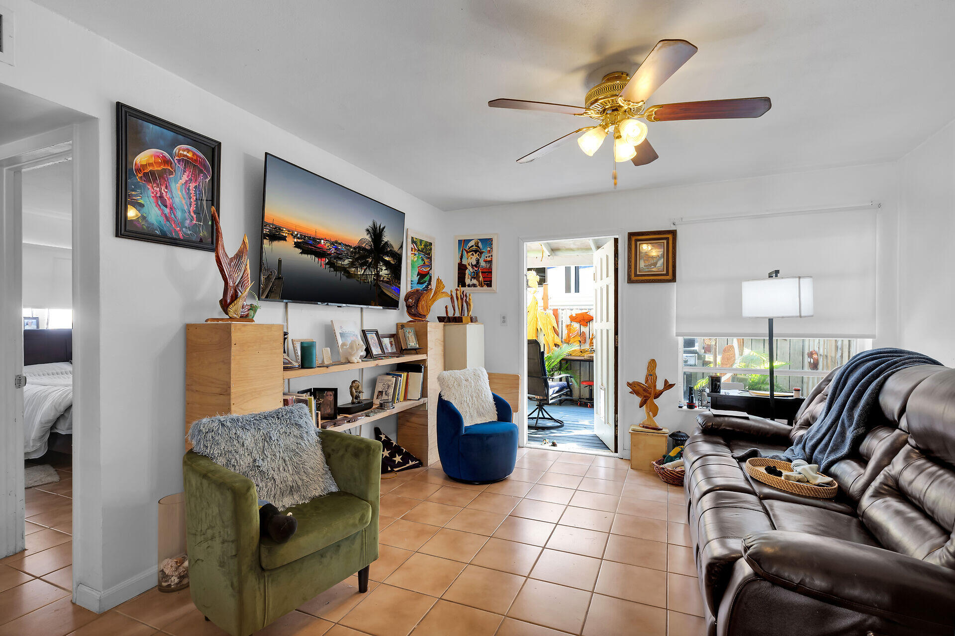 1614 Dennis Street Key West, FL 33040 - Photo 38 of 59 a living room with furniture and a flat screen tv